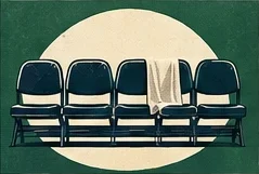 A row of bench seats with a towel